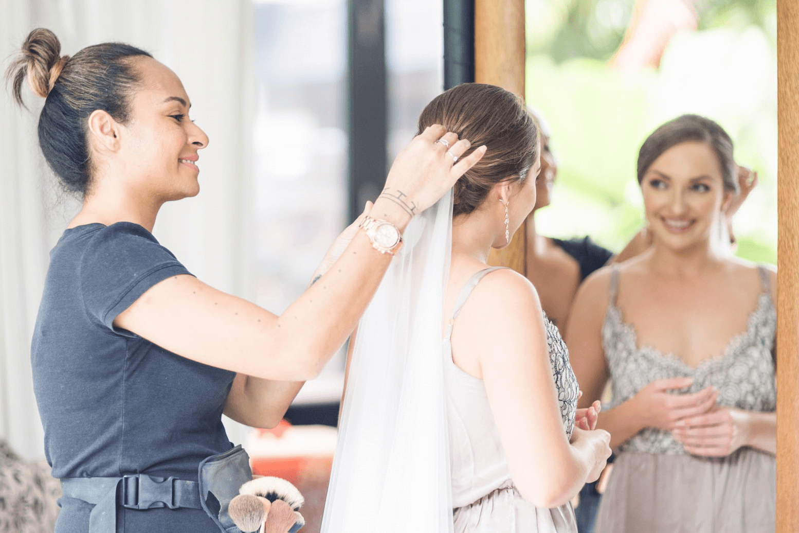 An artist preparing the bride for the weddings ceremony