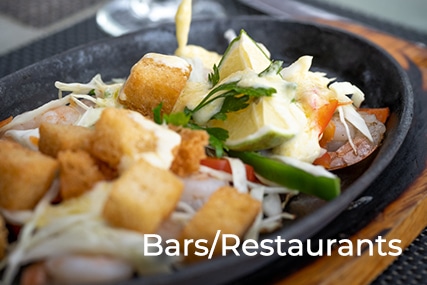 A delicious sizzling food with a word BARS AND RESTAURANT