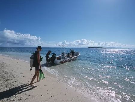 A woman and a boat in the sea